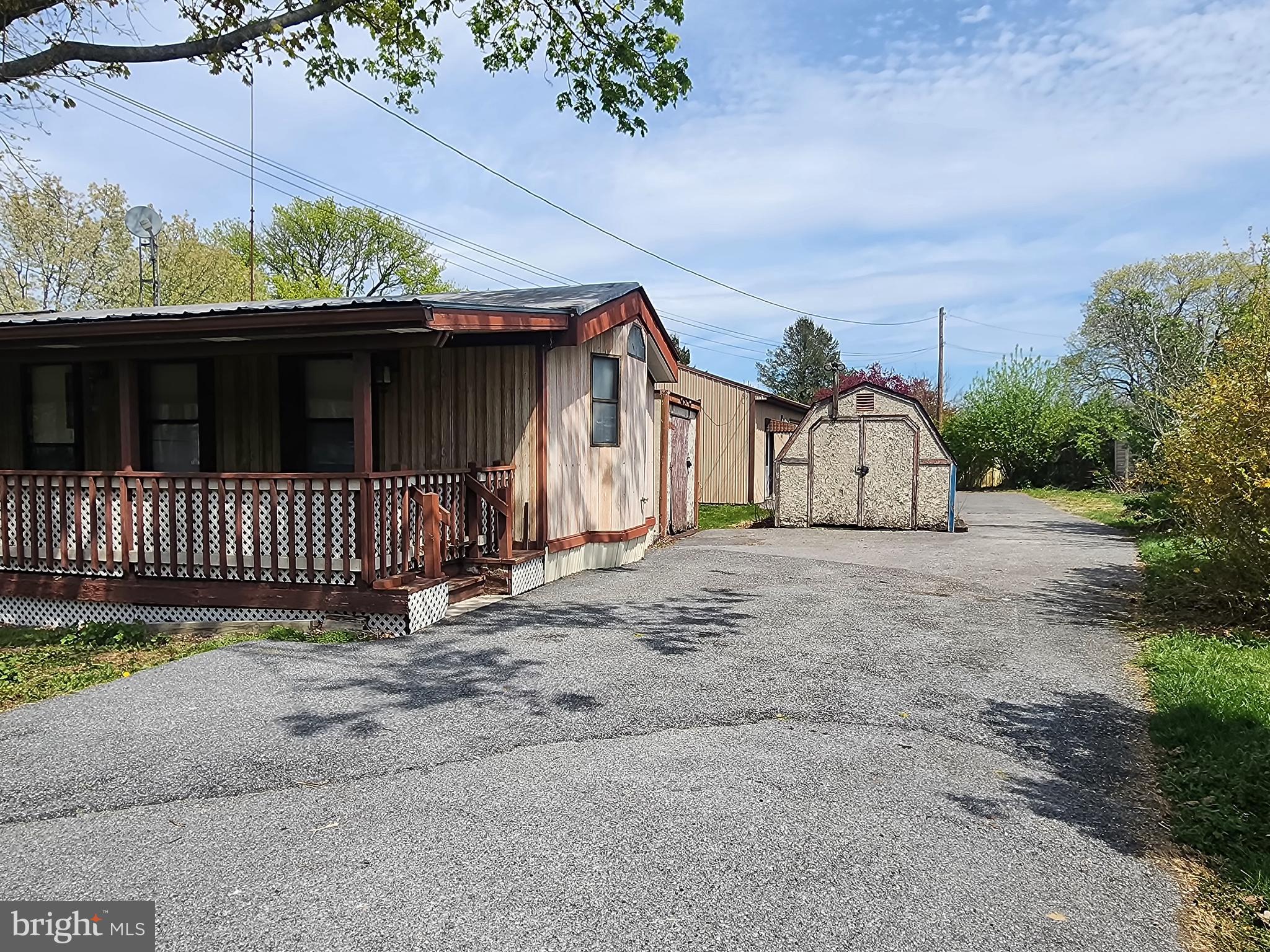 109 Neil Road Shippensburg, PA 17257 - Photo 37 of 62 a view of a house with a small yard and a garage