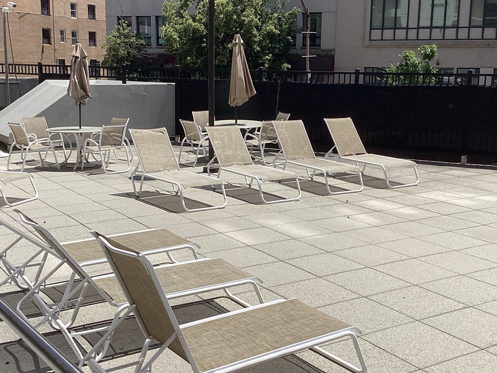 566 Commonwealth Avenue, Unit 101 Boston, MA 02215 - Photo 11 of 17 a view of a terrace with furniture