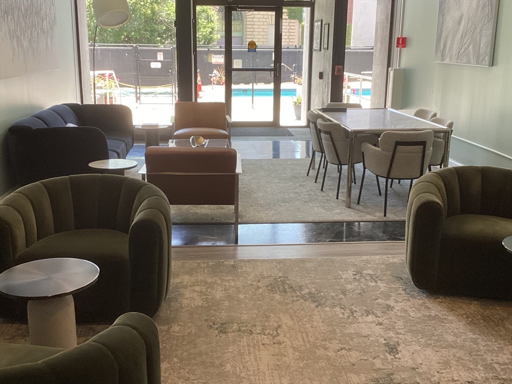 566 Commonwealth Avenue, Unit 101 Boston, MA 02215 - Photo 13 of 17 a living room with furniture and a large window