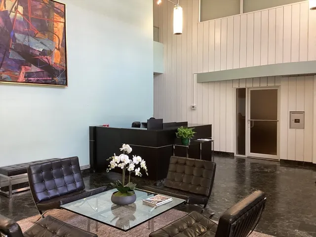 a view of a workspace with furniture