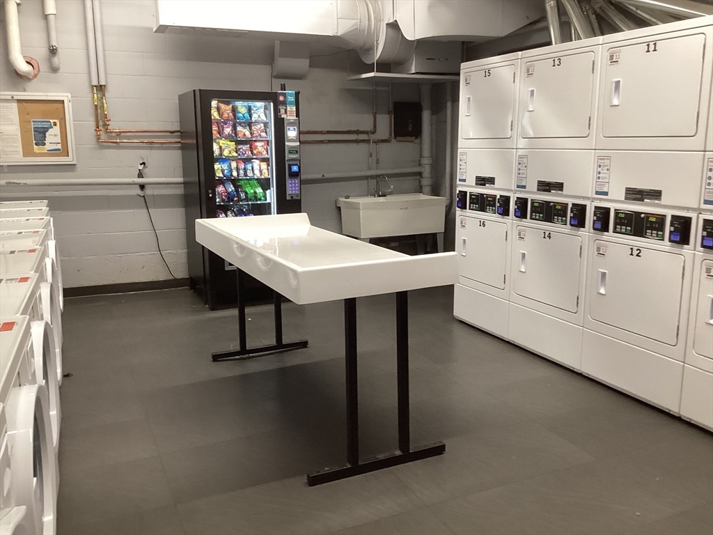 566 Commonwealth Avenue, Unit 101 Boston, MA 02215 - Photo 17 of 17 a kitchen with appliances cabinets and a counter top space