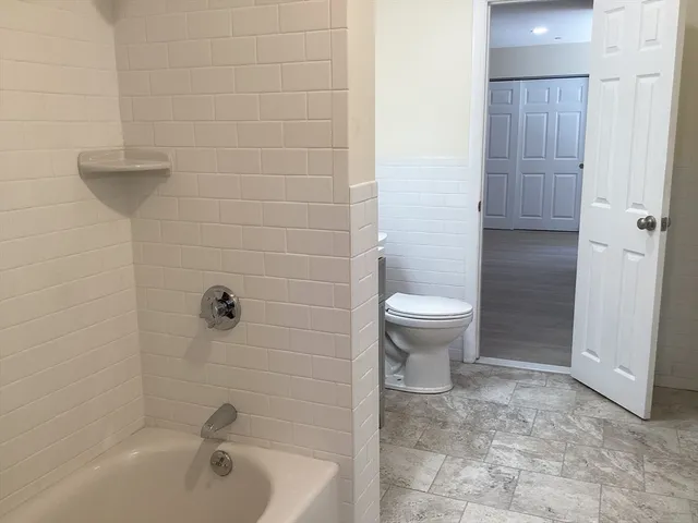 a bathroom with a toilet and a sink