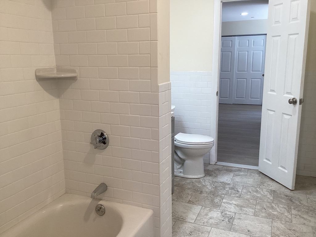 566 Commonwealth Avenue, Unit 101 Boston, MA 02215 - Photo 3 of 17 a bathroom with a toilet and a sink
