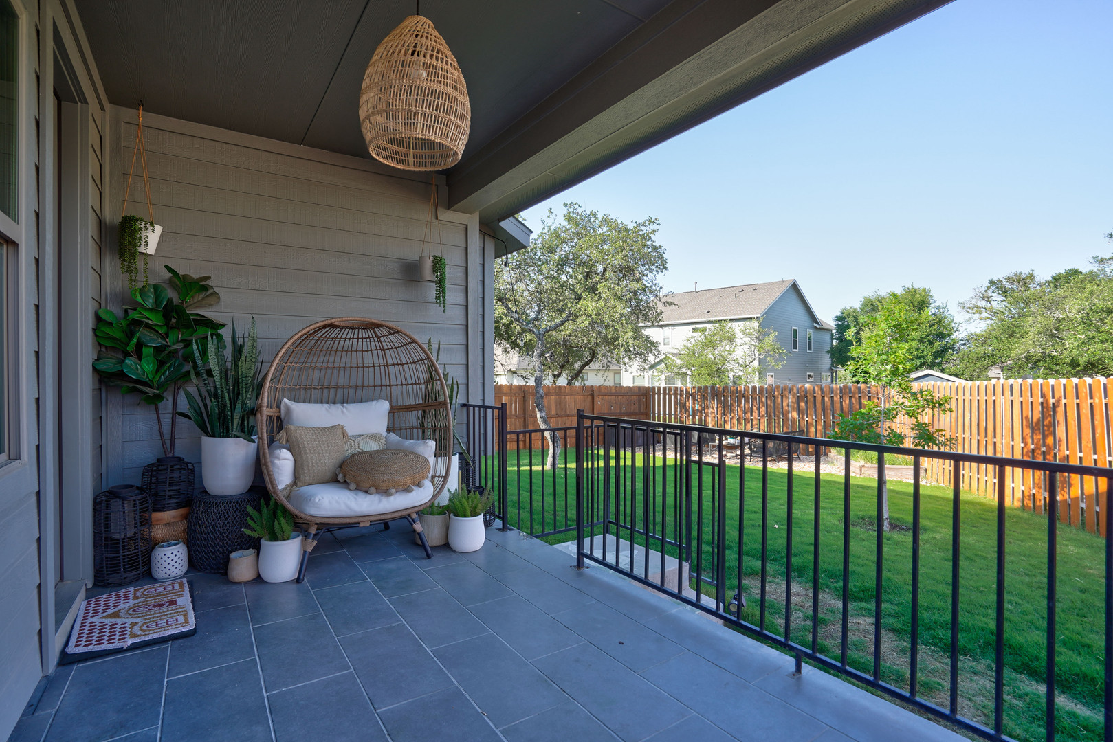 2240 Ringstaff Road Leander, TX 78641 - Photo 21 of 25 Covered patio featuring tiled flooring and a black metal railing