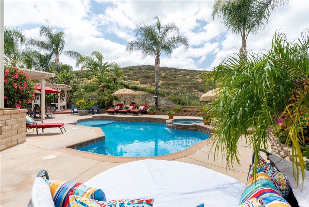 a view of a swimming pool with lounge chairs