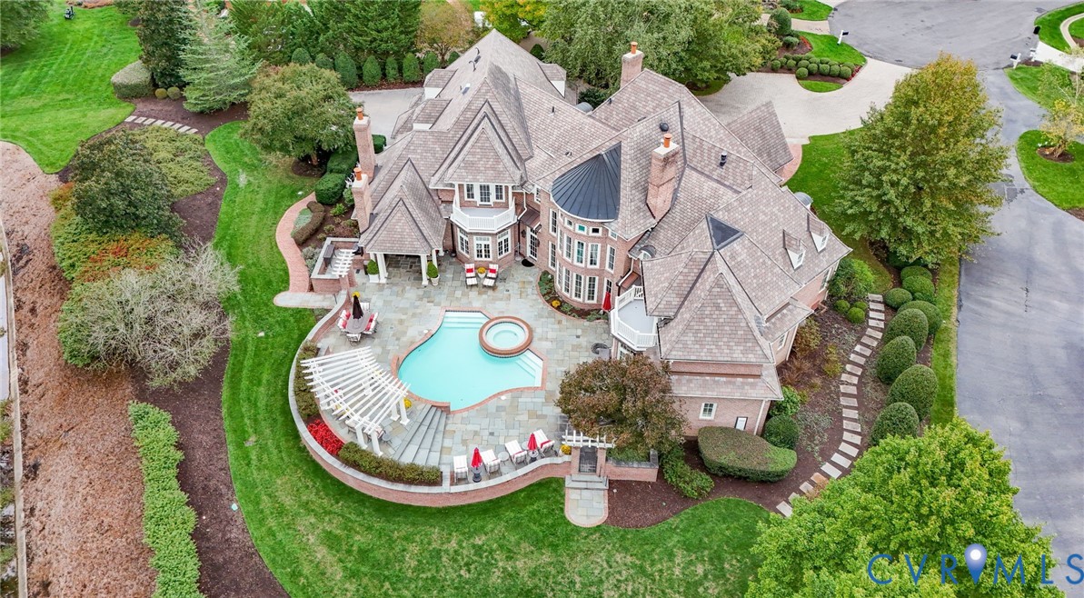 an aerial view of a house with outdoor space