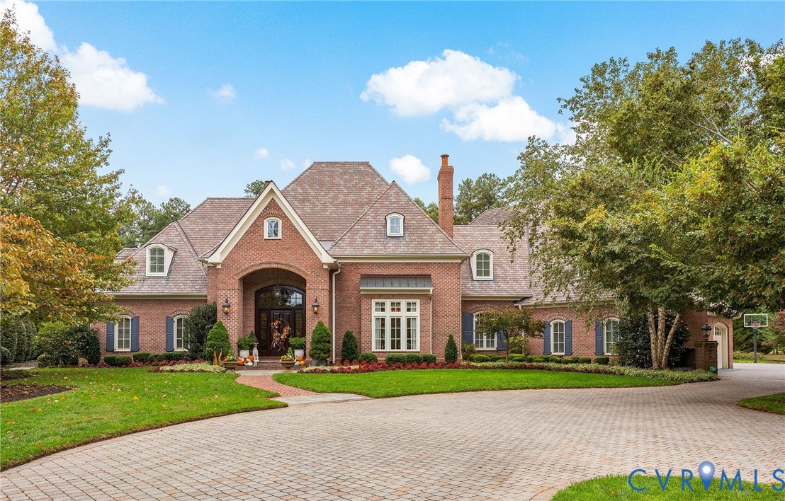 2725 Stonegate Court Midlothian, VA 23113 - Photo 2 of 50 a front view of a house with a yard and trees