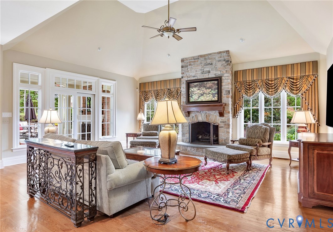 2725 Stonegate Court Midlothian, VA 23113 - Photo 21 of 50 a living room with furniture large window and a fireplace
