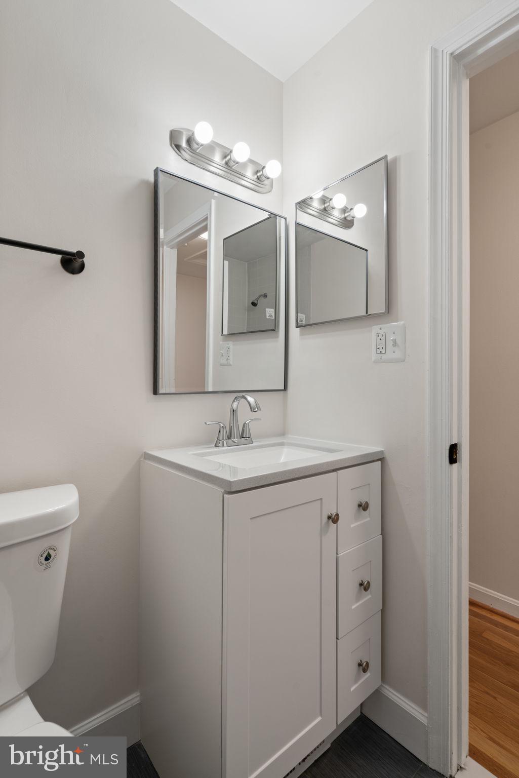 4355 Lorcom Lane Arlington, VA 22207 - Photo 18 of 36 New vanity, toilet, light, mirror Hall BA