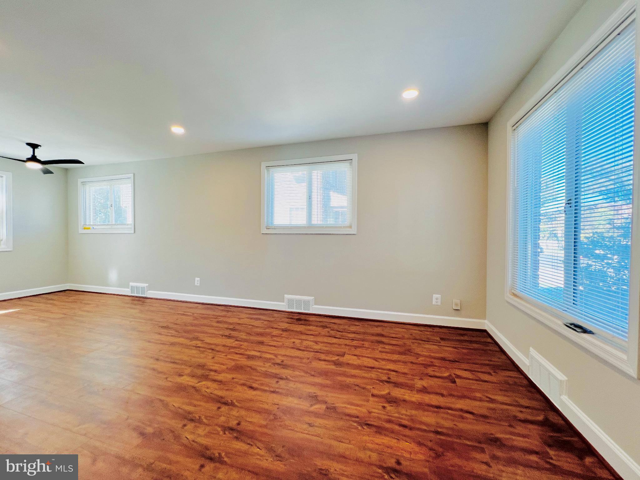 75 58th Street Southeast Washington, DC 20019 - Photo 11 of 40 wooden floor in an empty room with a window