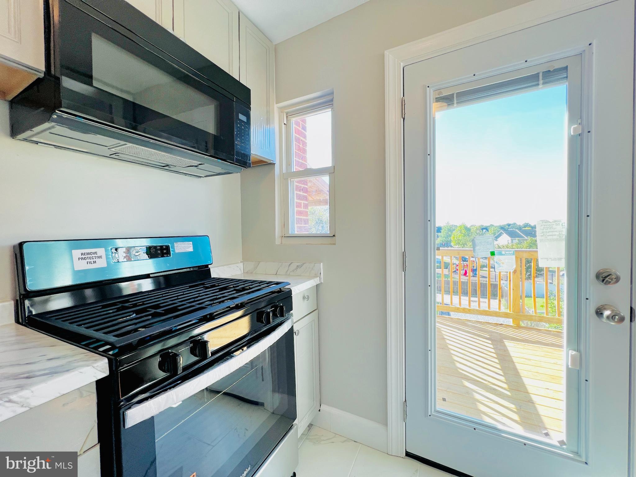 75 58th Street Southeast Washington, DC 20019 - Photo 15 of 40 Bright kitchen with scenic outdoor access.