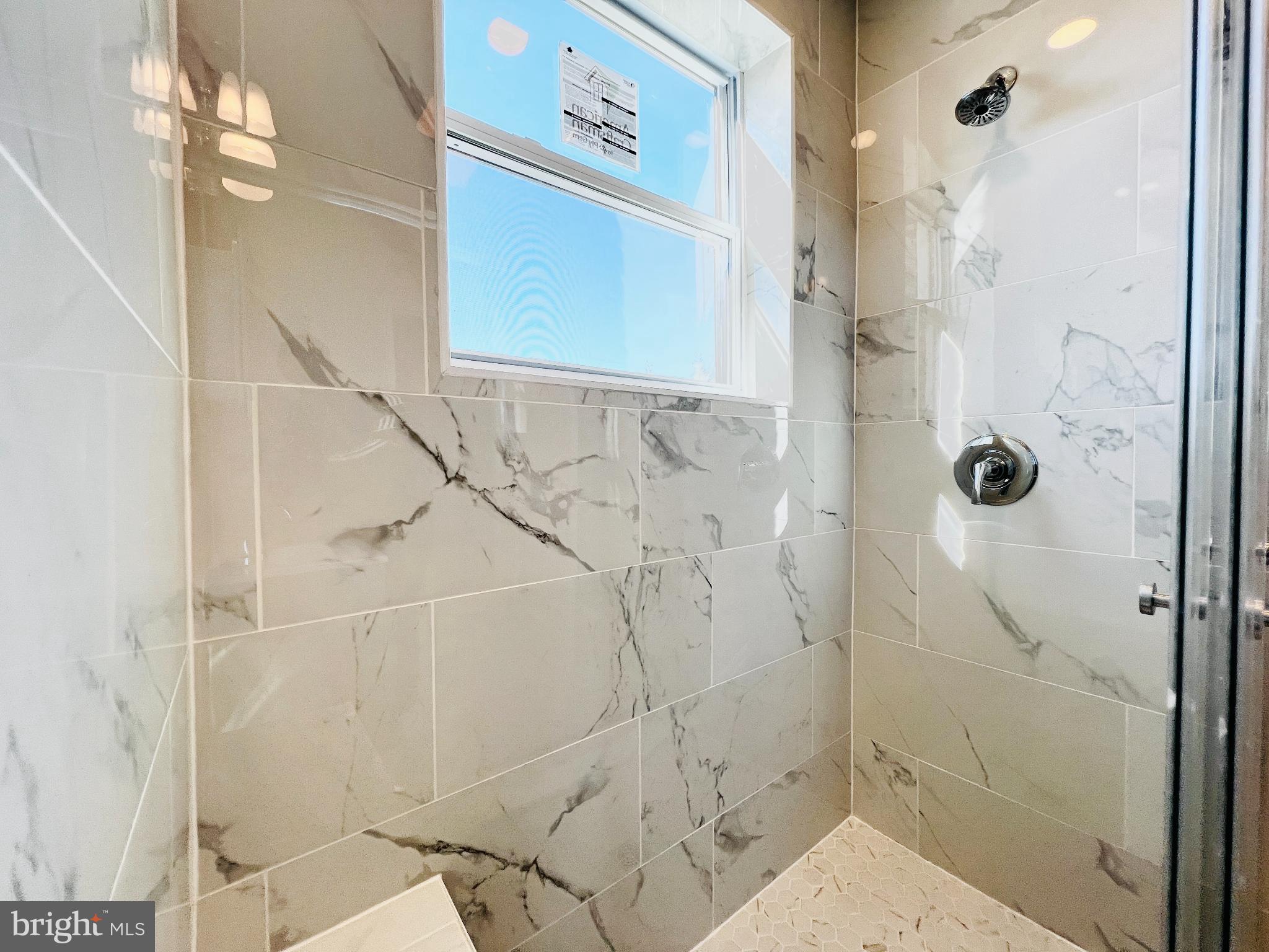 75 58th Street Southeast Washington, DC 20019 - Photo 23 of 40 Elegant shower with modern marble tiles.