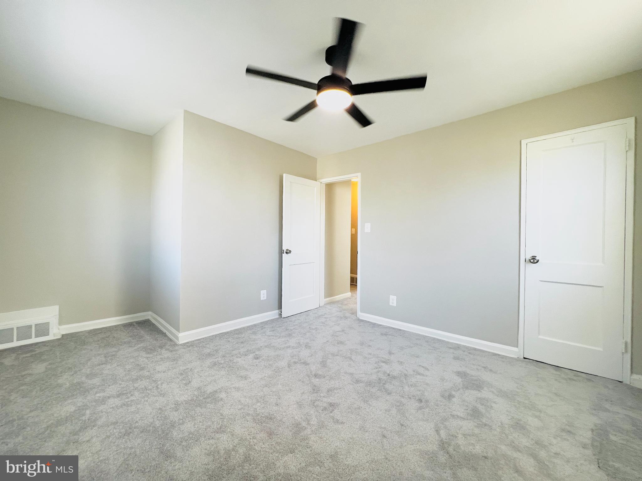 75 58th Street Southeast Washington, DC 20019 - Photo 28 of 40 Spacious, light-filled room with modern fan.