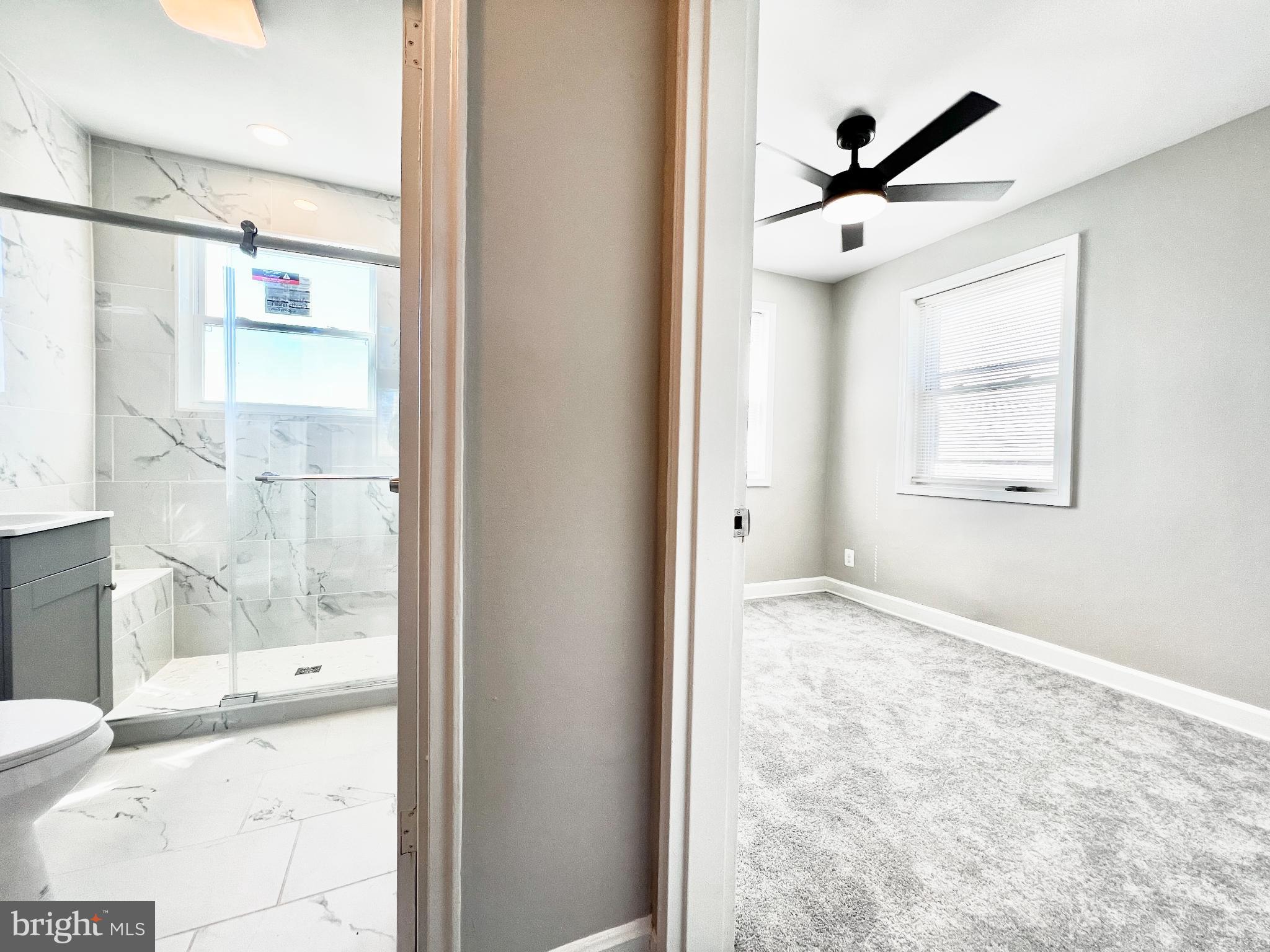 75 58th Street Southeast Washington, DC 20019 - Photo 29 of 40 a view of a big room with a chandelier fan and windows