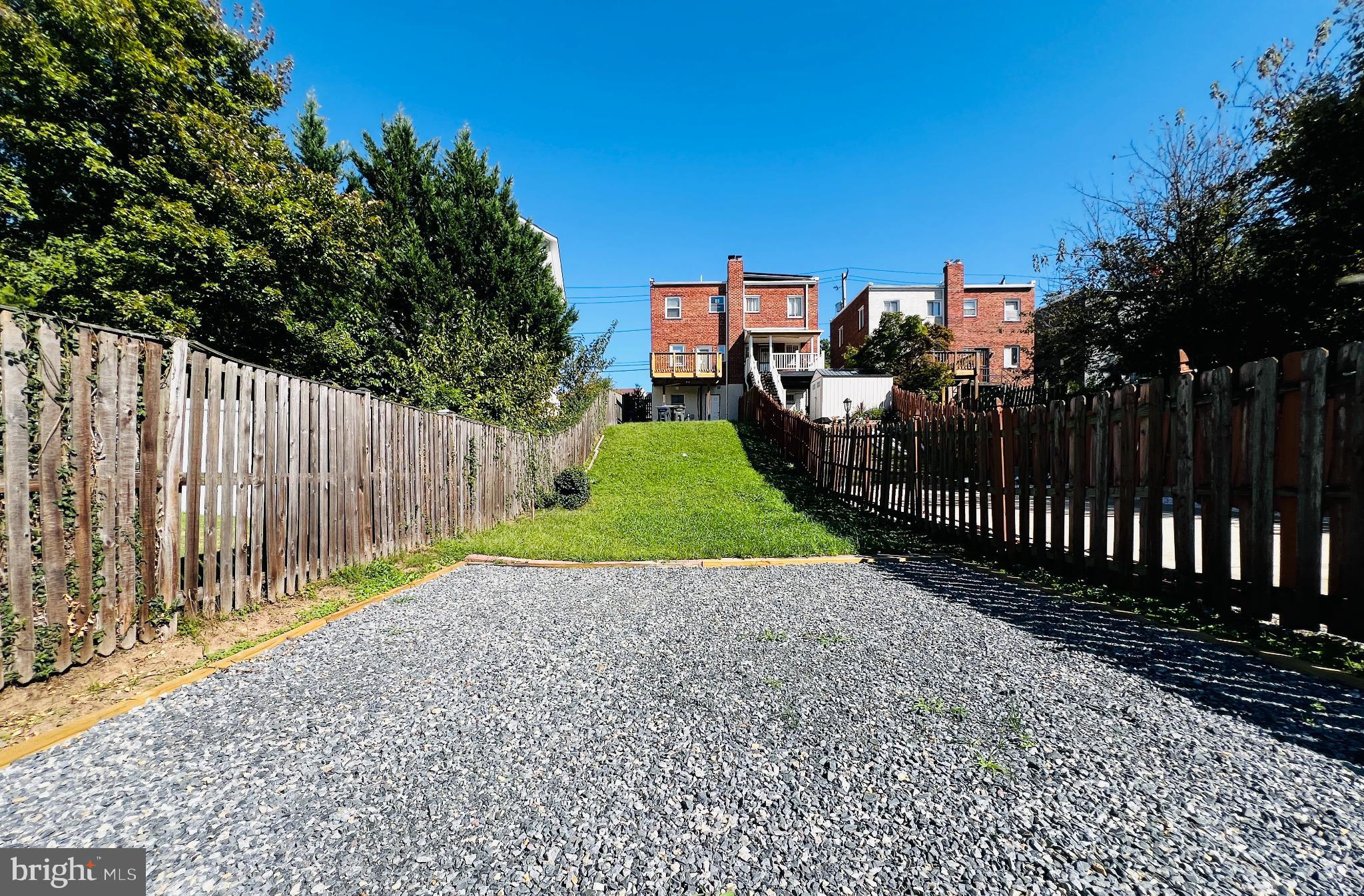 75 58th Street Southeast Washington, DC 20019 - Photo 3 of 40 Spacious backyard with parking pad