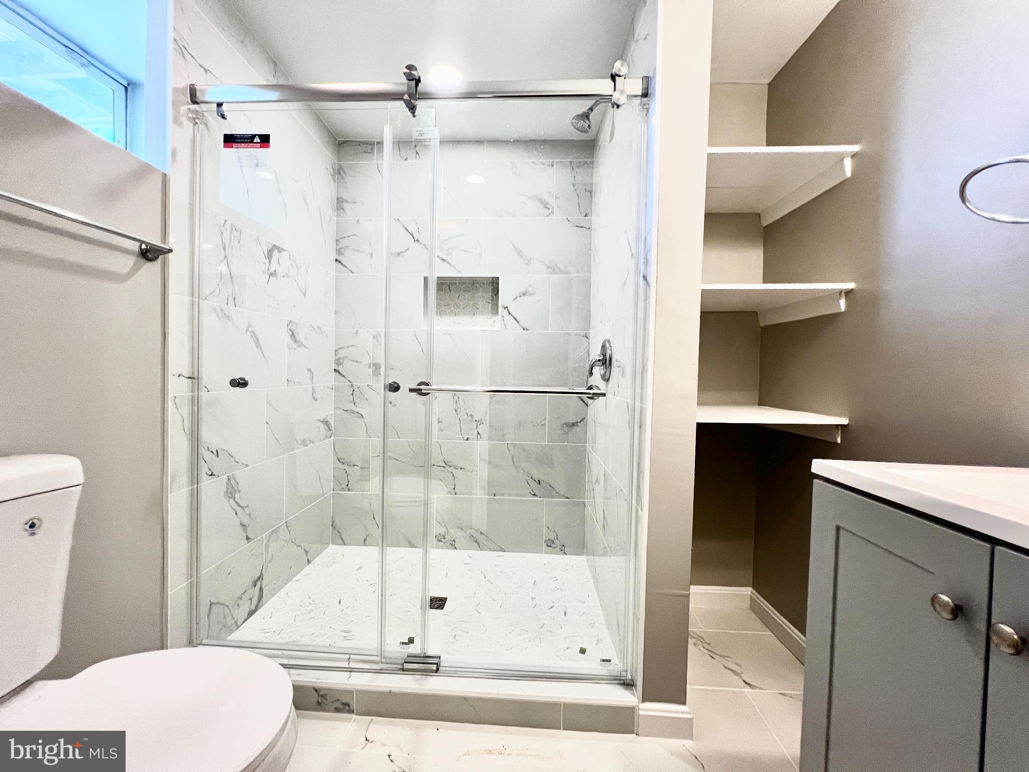 75 58th Street Southeast Washington, DC 20019 - Photo 31 of 40 a bathroom with a shower and a toilet