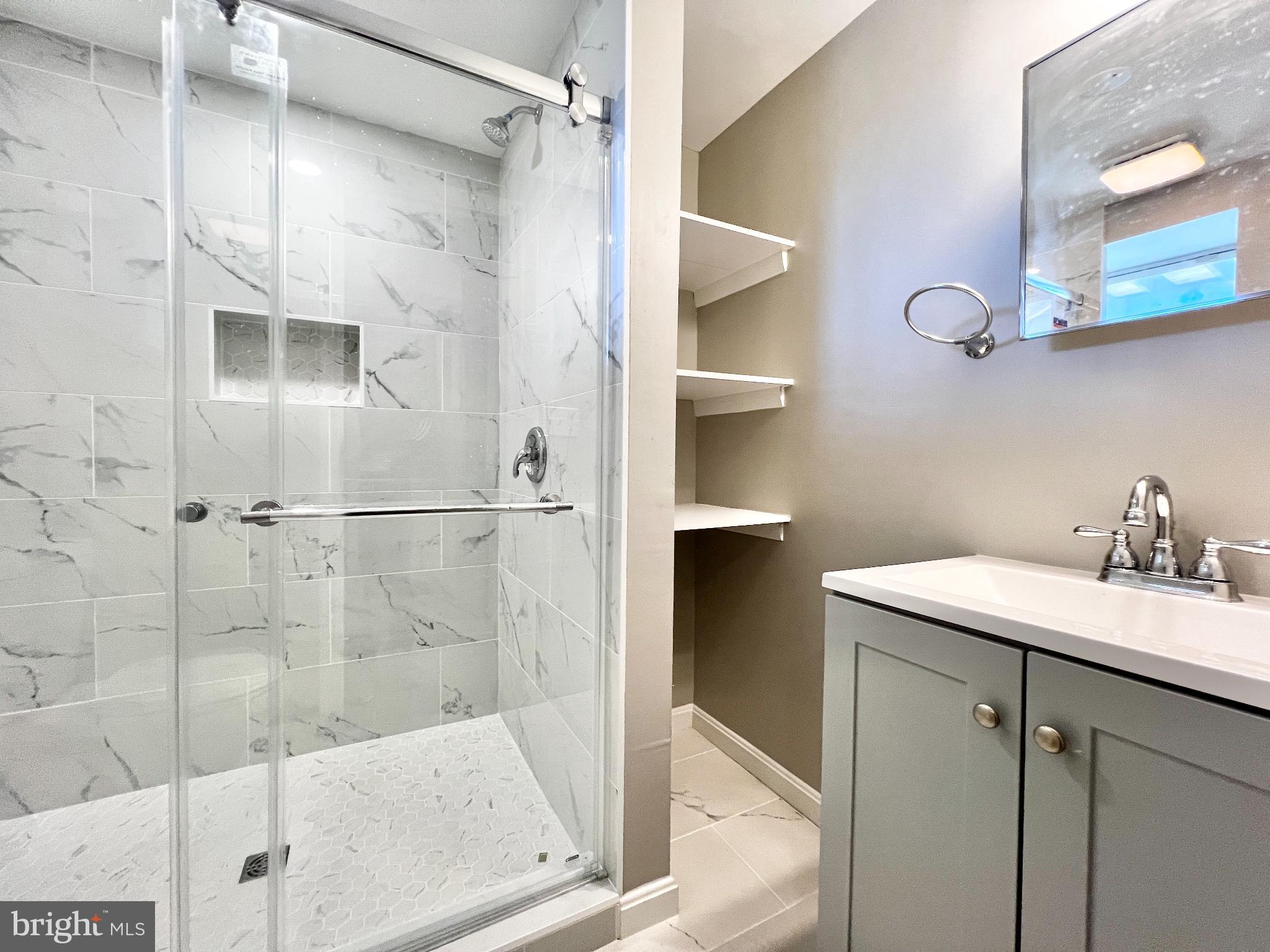 75 58th Street Southeast Washington, DC 20019 - Photo 32 of 40 a bathroom with a sink and a mirror