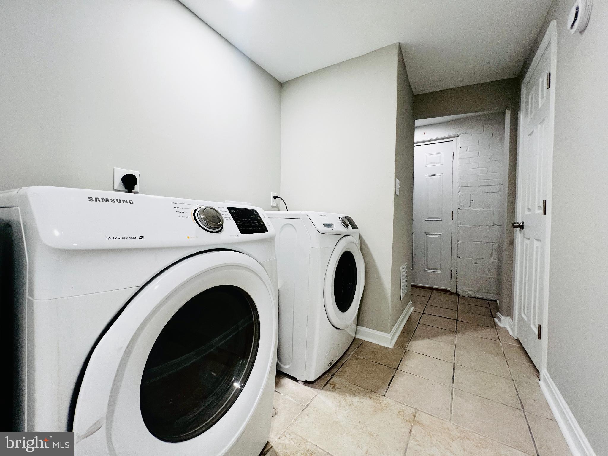 75 58th Street Southeast Washington, DC 20019 - Photo 37 of 40 Modern laundry space with sleek appliances.