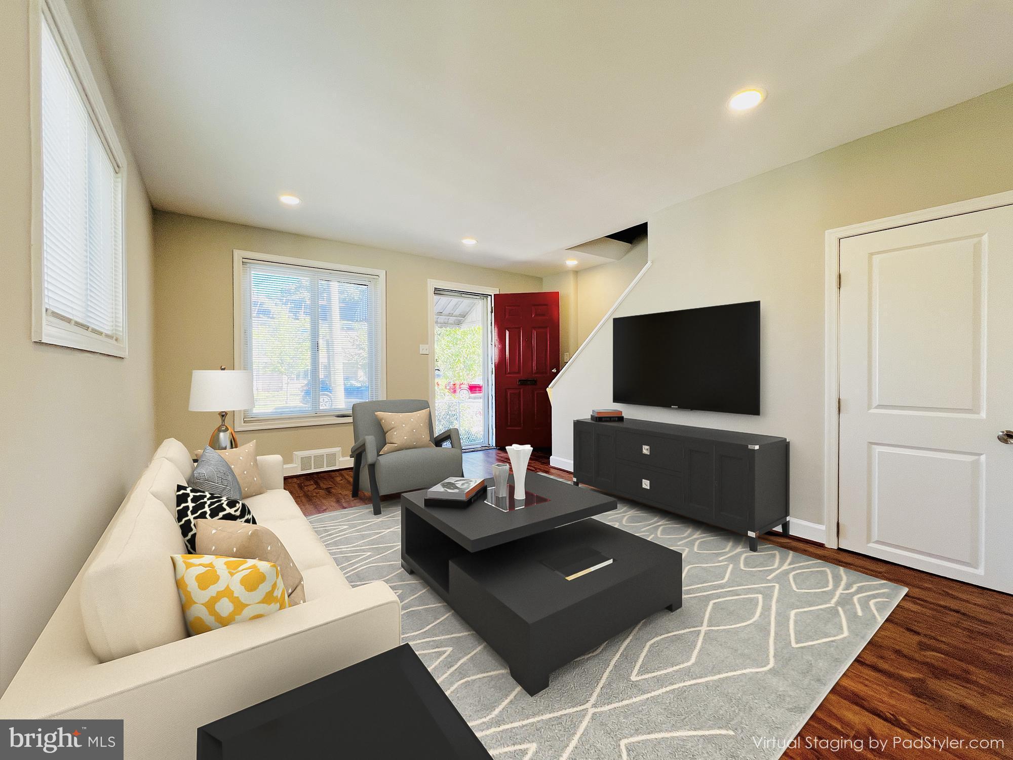 75 58th Street Southeast Washington, DC 20019 - Photo 4 of 40 a living room with furniture and a flat screen tv