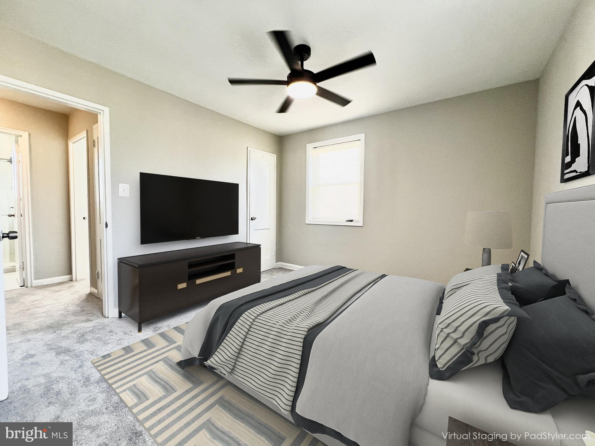 75 58th Street Southeast Washington, DC 20019 - Photo 8 of 40 a bedroom with a bed and a flat screen tv