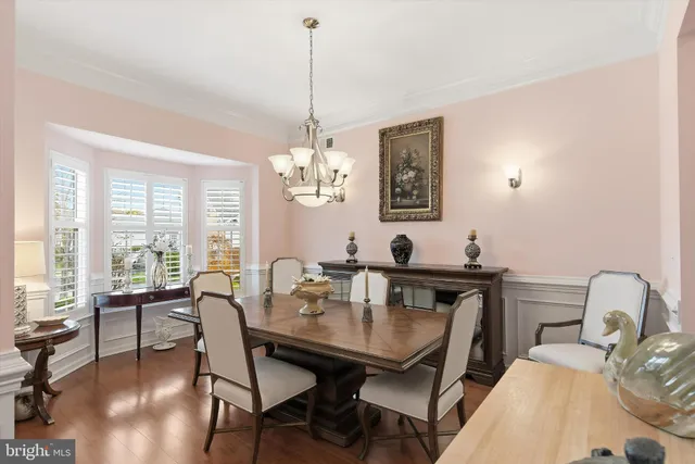 a view of a livingroom with furniture window and wooden floor