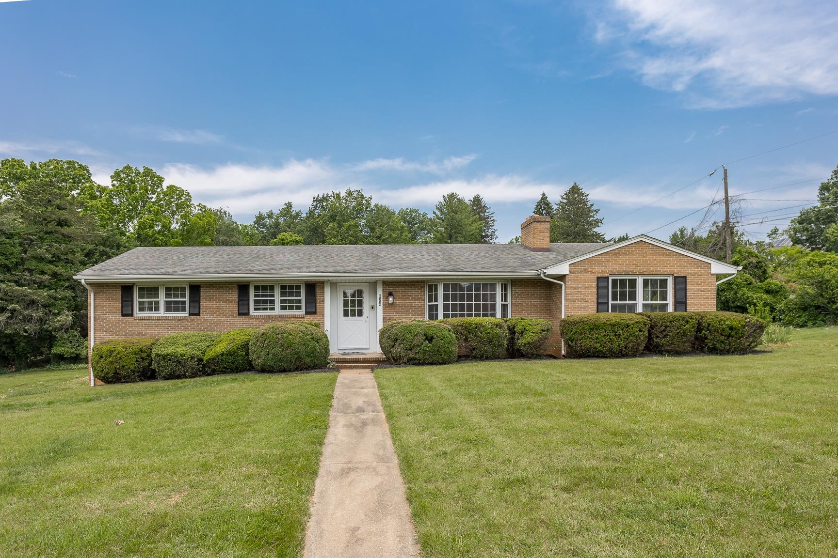 1002 North Coalter Street Staunton, VA 24401 - Photo 1 of 36 a front view of a house with a yard and garage