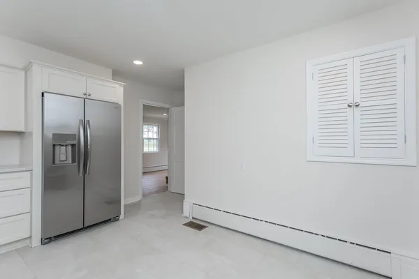 a view of an empty room and a window