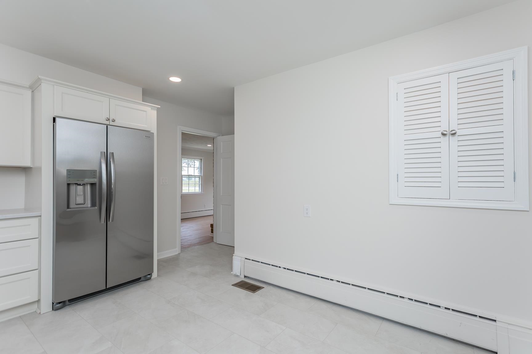 1002 North Coalter Street Staunton, VA 24401 - Photo 17 of 36 a view of an empty room and a window