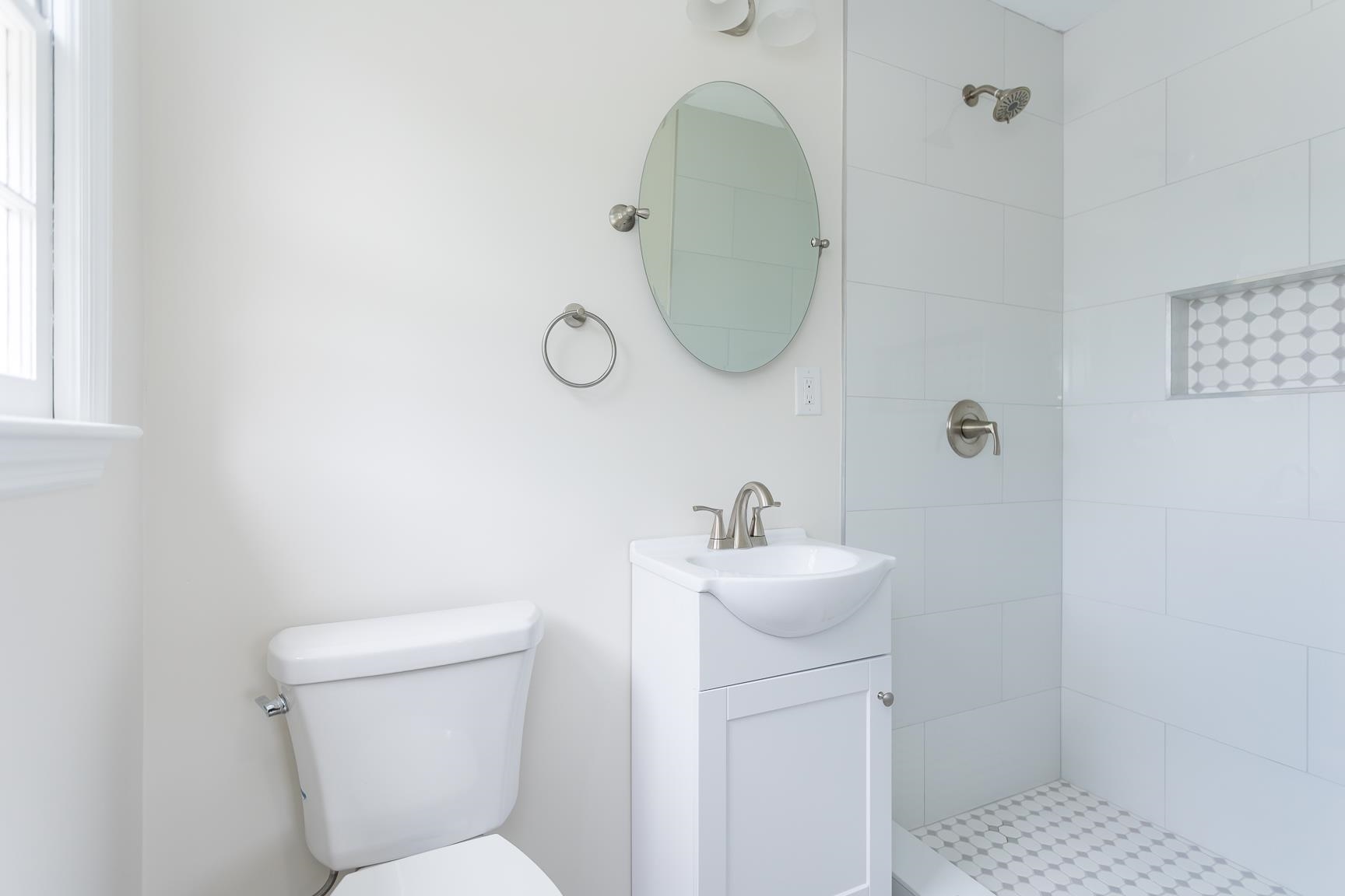 1002 North Coalter Street Staunton, VA 24401 - Photo 33 of 36 a bathroom with a toilet a sink and mirror