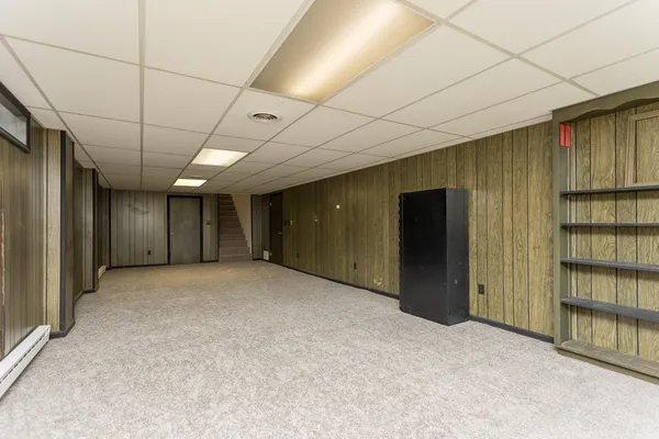 a view of empty room with furniture