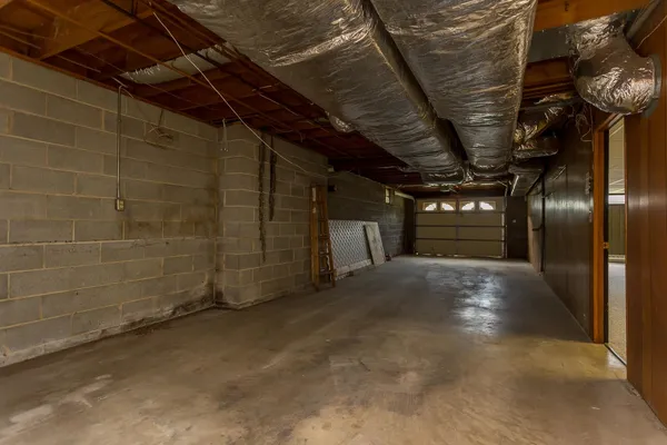 a view of empty room with wooden ceiling