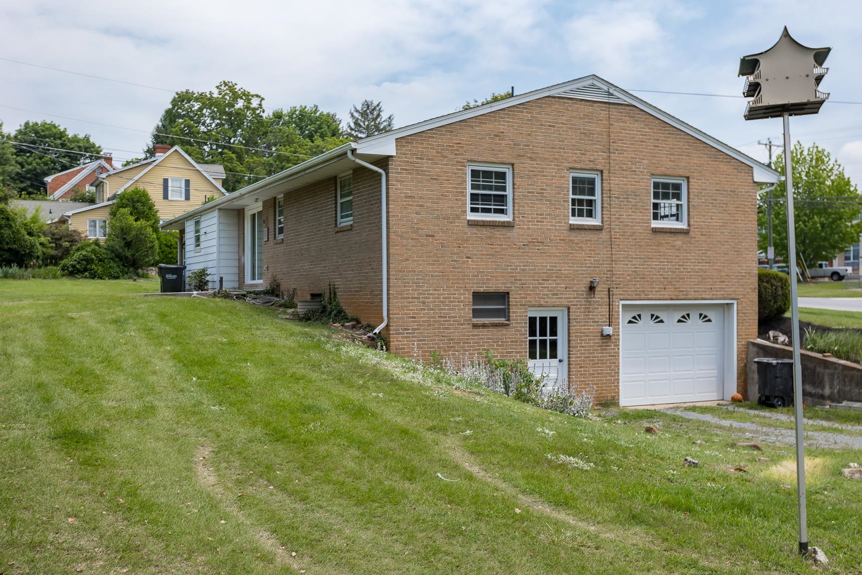 1002 North Coalter Street Staunton, VA 24401 - Photo 7 of 36 a front view of house with yard and garage