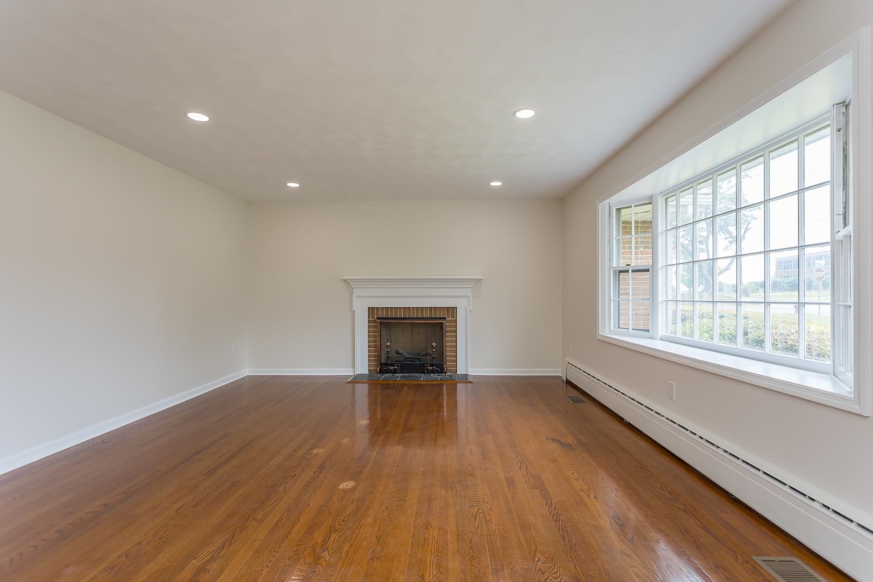1002 North Coalter Street Staunton, VA 24401 - Photo 10 of 36 wooden floor in an empty room with a window
