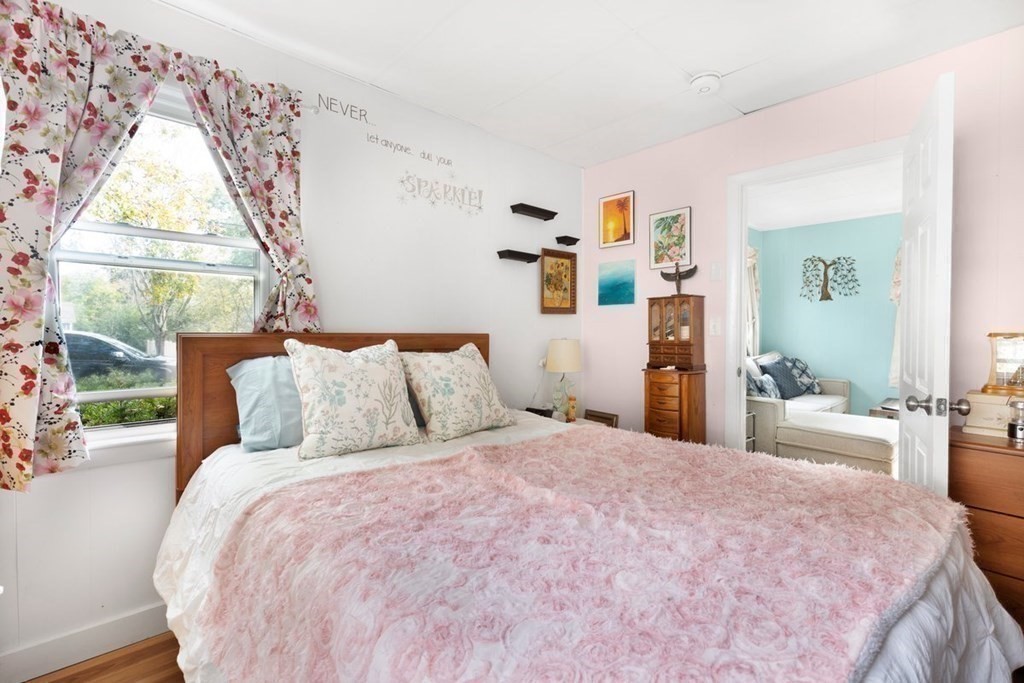 4 Benjamin Road Shirley, MA 01464 - Photo 16 of 25 a bedroom with a large bed and a window