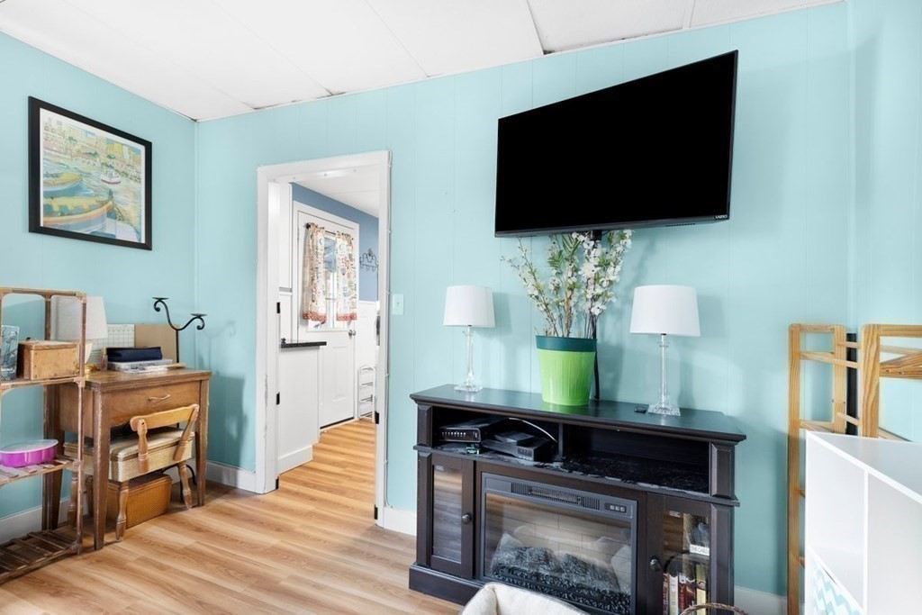 4 Benjamin Road Shirley, MA 01464 - Photo 8 of 25 a living room with furniture and a flat screen tv