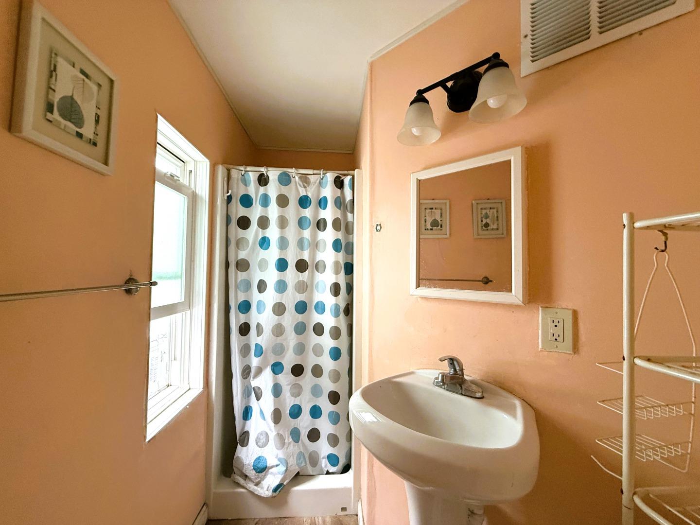 60 Wilson Way, Unit 150 Milpitas, CA 95035 - Photo 3 of 12 a bathroom with a sink and a mirror