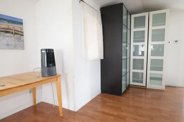 a view of a kitchen from an empty room
