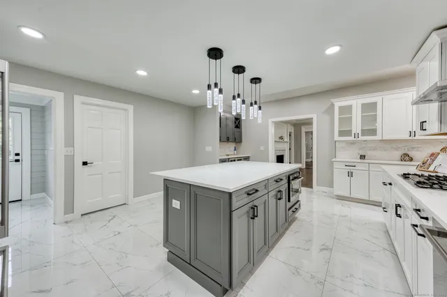 a kitchen that has a lot of cabinets in it