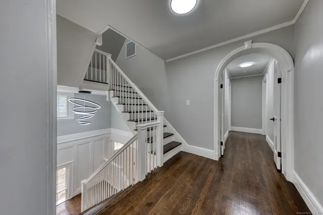a view of an entryway with wooden floor