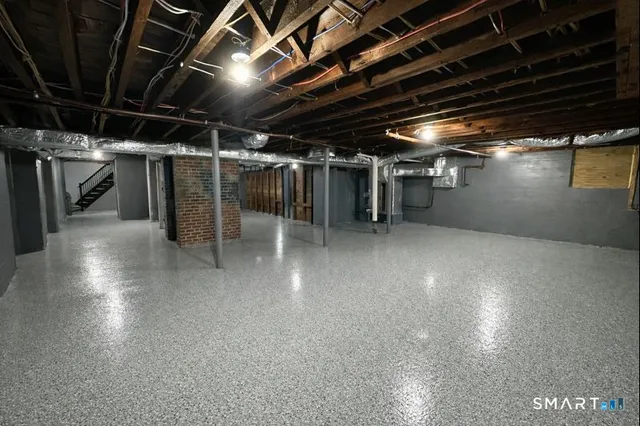 a view of empty room with wooden ceiling
