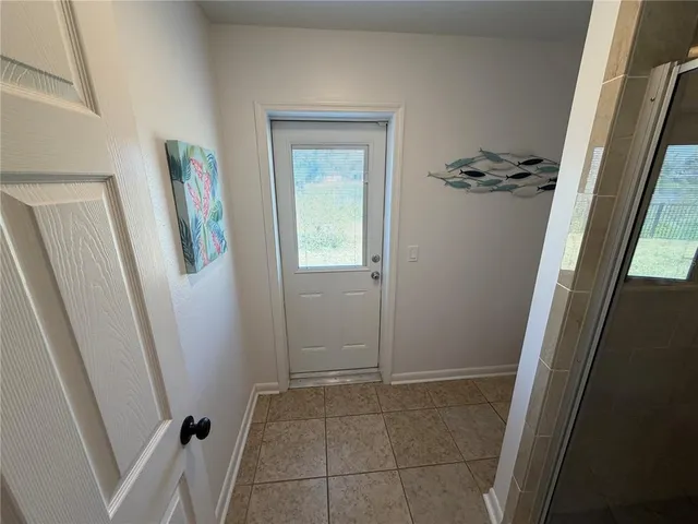 a view of an entryway with a mirror