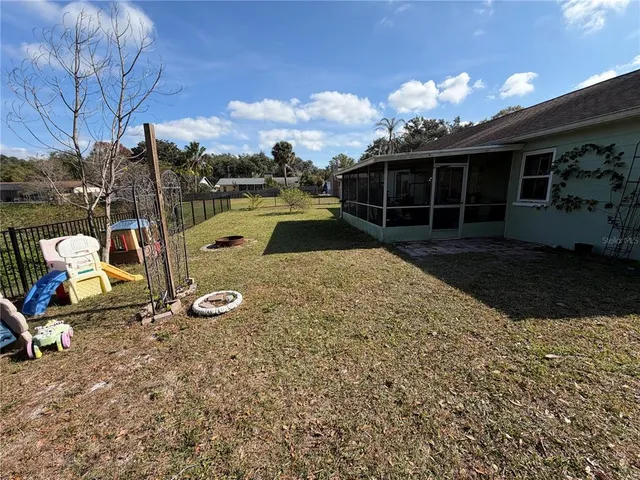a view of a backyard with sitting area and furniture