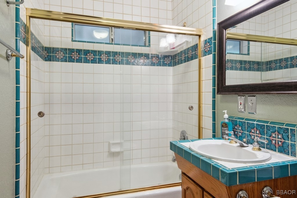 23697 Bowl Road Crestline, CA 92325 - Photo 19 of 28 a bathroom with a sink and a mirror