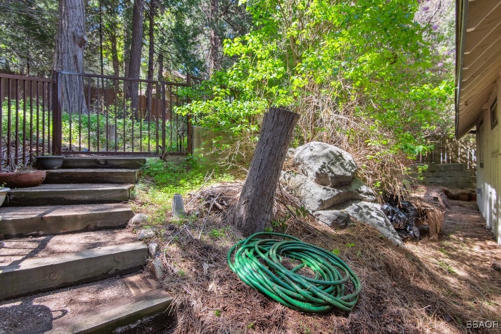 23697 Bowl Road Crestline, CA 92325 - Photo 27 of 28 a view of a backyard with plants and a garden
