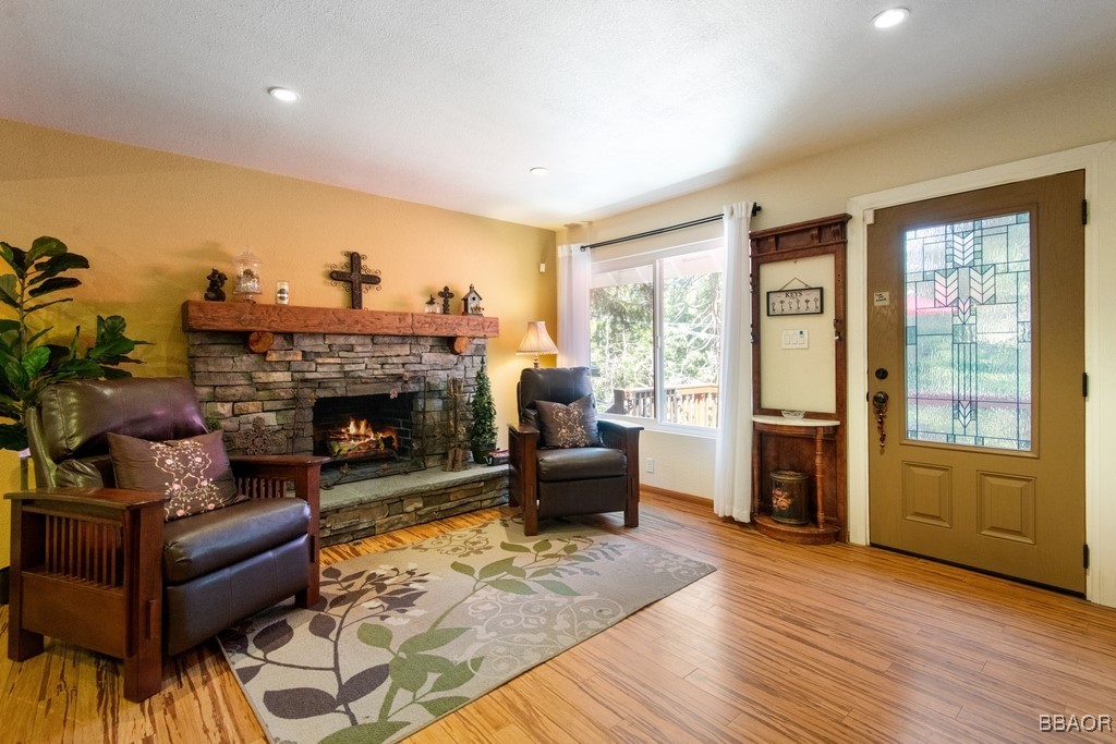 23697 Bowl Road Crestline, CA 92325 - Photo 7 of 28 a living room with furniture and a fireplace