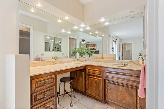 a bathroom with a sink double vanity and a mirror