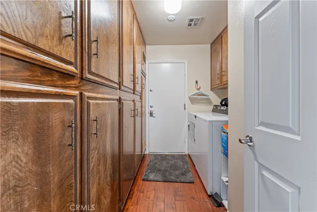 a view of hallway with wooden floor