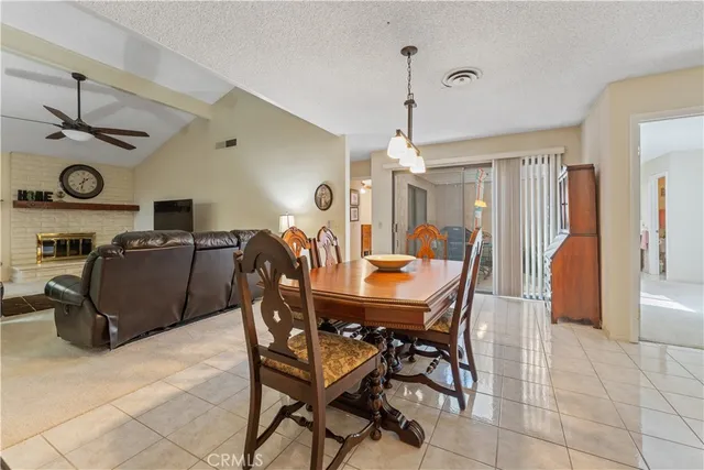 a view of a dining room with furniture and a large window