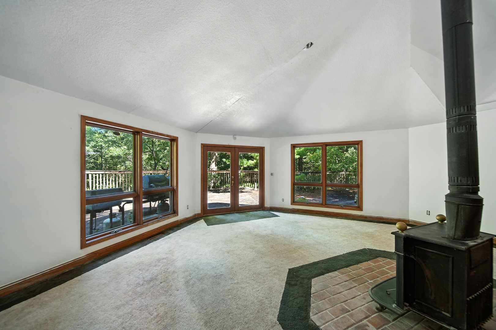 21631 Hoover Road Sterling, IL 61081 - Photo 12 of 30 a living room with a large window and a fireplace