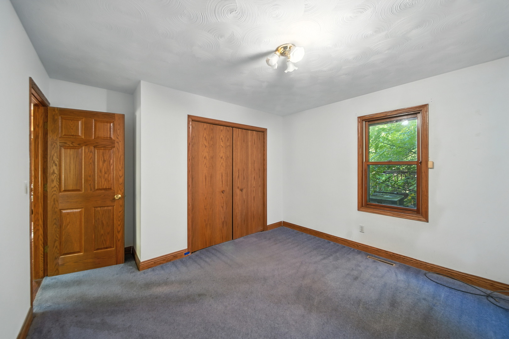 21631 Hoover Road Sterling, IL 61081 - Photo 16 of 30 an empty room with windows and closet